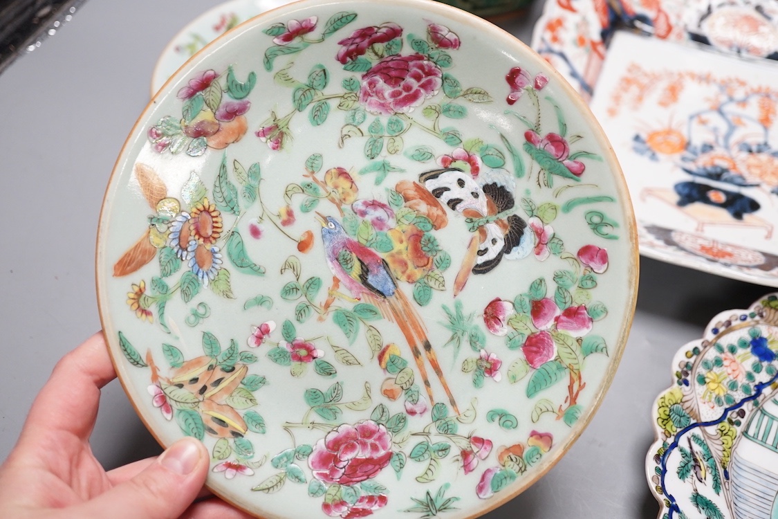 A 19th century Chinese blue and white 'prunus' vase, a Chinese green glazed jar, a japanese vase and two dishes and two Canton famille rose plates (7)